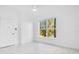 Bright bedroom with large window and tile floors at 3714 Palm Desert Ln # 5317, Orlando, FL 32839