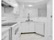 Bright kitchen featuring white cabinetry and modern appliances at 3714 Palm Desert Ln # 5317, Orlando, FL 32839