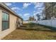 Large backyard with grassy area and privacy fence at 3829 Arborvitae Way, Deland, FL 32724