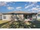 The backyard includes a covered patio area ideal for relaxation and outdoor gatherings at 3829 Arborvitae Way, Deland, FL 32724