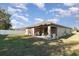 Backyard with patio, grassy area, and privacy fence at 3829 Arborvitae Way, Deland, FL 32724