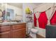 Clean bathroom, bathtub, toilet and vanity with granite countertop at 3829 Arborvitae Way, Deland, FL 32724