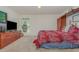 Spacious bedroom with a built-in shelving unit and a large window at 3829 Arborvitae Way, Deland, FL 32724