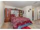 Bright bedroom with a queen bed and built-in storage at 3829 Arborvitae Way, Deland, FL 32724