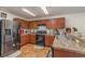 Kitchen with stainless steel appliances and wood cabinets at 3829 Arborvitae Way, Deland, FL 32724