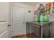 Convenient laundry room with modern machines, storage shelves and easy access to adjacent rooms at 3829 Arborvitae Way, Deland, FL 32724