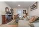 Living room with sectional sofa, coffee table, and decorative accents at 3829 Arborvitae Way, Deland, FL 32724
