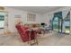 Living area with a recliner, sofa, and sliding glass doors at 3829 Arborvitae Way, Deland, FL 32724