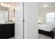 Bathroom with single vanity and access to bedroom at 4298 Lana Ave, Davenport, FL 33897