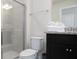 Clean bathroom with shower and dark vanity at 4298 Lana Ave, Davenport, FL 33897