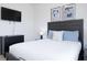 Bright bedroom with a comfortable bed and modern dresser at 4298 Lana Ave, Davenport, FL 33897