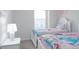 Charming bedroom with two twin beds and Disney themed bedding at 4298 Lana Ave, Davenport, FL 33897