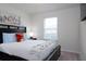 Bright bedroom with a comfortable bed and window coverings at 4298 Lana Ave, Davenport, FL 33897
