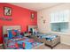 bedroom with twin beds and superhero themed decor at 4298 Lana Ave, Davenport, FL 33897