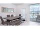 Modern dining room with gray wood table and bench seating at 4298 Lana Ave, Davenport, FL 33897