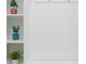 White built-in bench with storage shelves in the entryway at 4298 Lana Ave, Davenport, FL 33897