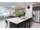 Modern kitchen featuring stainless steel appliances and granite countertops at 4298 Lana Ave, Davenport, FL 33897
