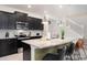 Modern kitchen with island seating and stainless steel appliances at 4298 Lana Ave, Davenport, FL 33897