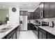 Modern kitchen with stainless steel appliances and granite countertops at 4298 Lana Ave, Davenport, FL 33897