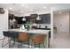 Modern kitchen with island seating and stainless steel appliances at 4298 Lana Ave, Davenport, FL 33897
