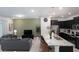Open floor plan boasts modern kitchen with granite island and spacious living area at 4298 Lana Ave, Davenport, FL 33897