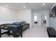 Upstairs loft with foosball table and comfy seating at 4298 Lana Ave, Davenport, FL 33897