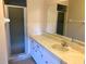 Bathroom with shower stall, vanity sink, and mirrored medicine cabinet at 5123 Picadilly Circus Ct # 2, Orlando, FL 32839
