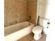 Bathroom with a combined tub and shower, with tile walls, and a standard toilet at 5123 Picadilly Circus Ct # 2, Orlando, FL 32839