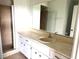 Bathroom featuring a vanity with sink, a mirror, and a tiled shower at 5123 Picadilly Circus Ct # 2, Orlando, FL 32839