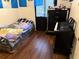 Small bedroom with a bed, dresser, and electronic keyboard at 5123 Picadilly Circus Ct # 2, Orlando, FL 32839