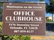 Sign for Huntington on the Green clubhouse, providing address and contact information at 5123 Picadilly Circus Ct # 2, Orlando, FL 32839