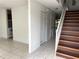 View of the entryway featuring a staircase with wooden steps and white risers at 5123 Picadilly Circus Ct # 2, Orlando, FL 32839