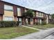 Brick townhouses with brown roofs and landscaping at 5123 Picadilly Circus Ct # 2, Orlando, FL 32839