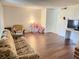Living room with laminate flooring and furniture at 5123 Picadilly Circus Ct # 2, Orlando, FL 32839