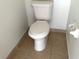 Close-up of a standard toilet with white porcelain and a tiled floor at 5123 Picadilly Circus Ct # 2, Orlando, FL 32839