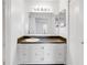 Well-lit bathroom with a large mirror, vanity with storage, and a pristine white sink at 542 Orange Dr # 22, Altamonte Springs, FL 32701