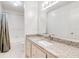 Well-lit bathroom features a large mirror, granite countertops, and a shower with tub at 542 Orange Dr # 22, Altamonte Springs, FL 32701