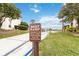 Boat ramp with sign, leading to waterfront views, surrounded by green grass at 542 Orange Dr # 22, Altamonte Springs, FL 32701