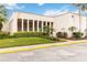 Well-maintained clubhouse at Royal Arms Condominiums featuring lush landscaping and palm trees at 542 Orange Dr # 22, Altamonte Springs, FL 32701