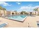Refreshing community pool with lounge chairs and surrounding buildings at 542 Orange Dr # 22, Altamonte Springs, FL 32701