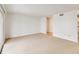 An empty room featuring neutral carpet, white walls and a doorway view to another room at 542 Orange Dr # 22, Altamonte Springs, FL 32701