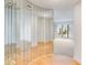 Hallway featuring unique mirrored wall accents with views to the outside at 542 Orange Dr # 22, Altamonte Springs, FL 32701
