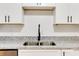 Bright kitchen with stainless steel sink, granite countertops, and shaker cabinets at 542 Orange Dr # 22, Altamonte Springs, FL 32701