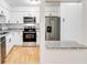 Updated kitchen with stainless steel appliances, granite countertops, and ample counter space at 542 Orange Dr # 22, Altamonte Springs, FL 32701