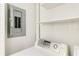 Small laundry room with washer, dryer and shelving at 542 Orange Dr # 22, Altamonte Springs, FL 32701