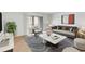Bright living room with sliding doors to balcony, modern furniture and stylish rug at 542 Orange Dr # 22, Altamonte Springs, FL 32701