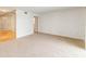 Bright living room with carpeting and partial views to a hallway and other living spaces at 542 Orange Dr # 22, Altamonte Springs, FL 32701
