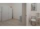 Clean bathroom with toilet and storage at 5521 Hogan Ln, Winter Haven, FL 33884