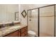 Bathroom with granite countertop, shower, and toilet at 5521 Hogan Ln, Winter Haven, FL 33884