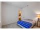 Bright bedroom with a double bed and access to a hallway at 5521 Hogan Ln, Winter Haven, FL 33884